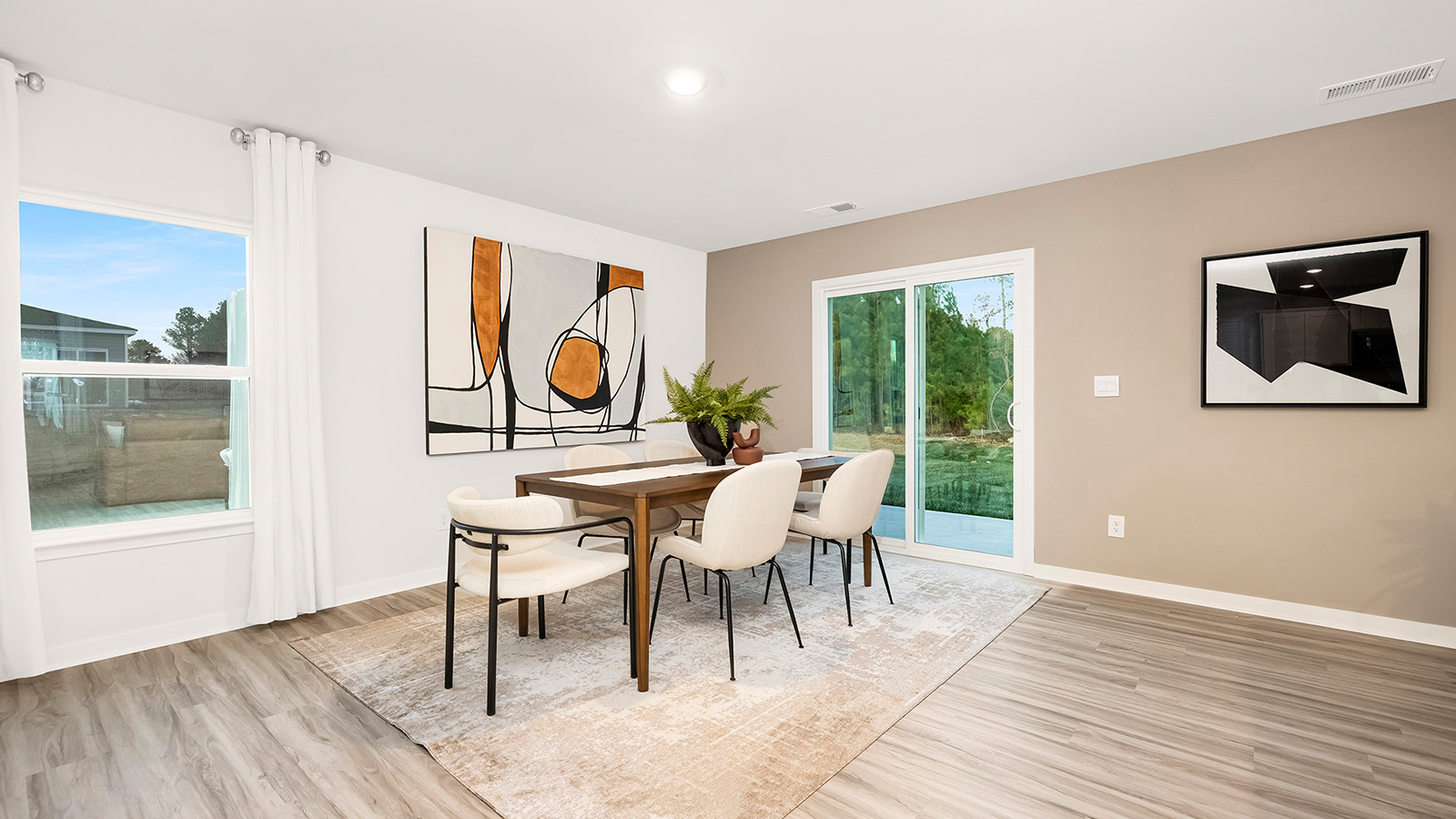 Dining area with wood floor and sliding glass door