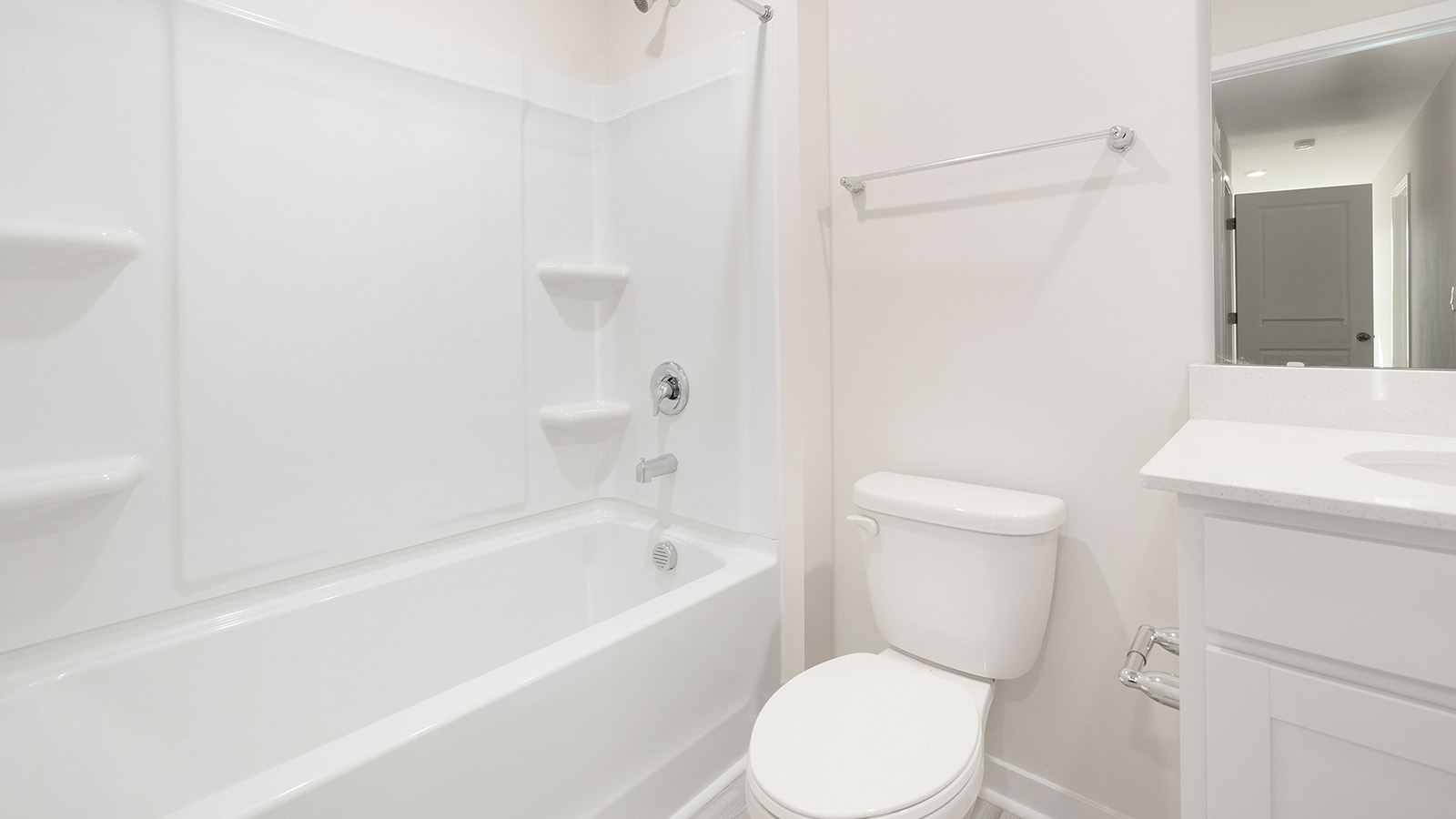 Bathroom with white cabinets and shower tub combination