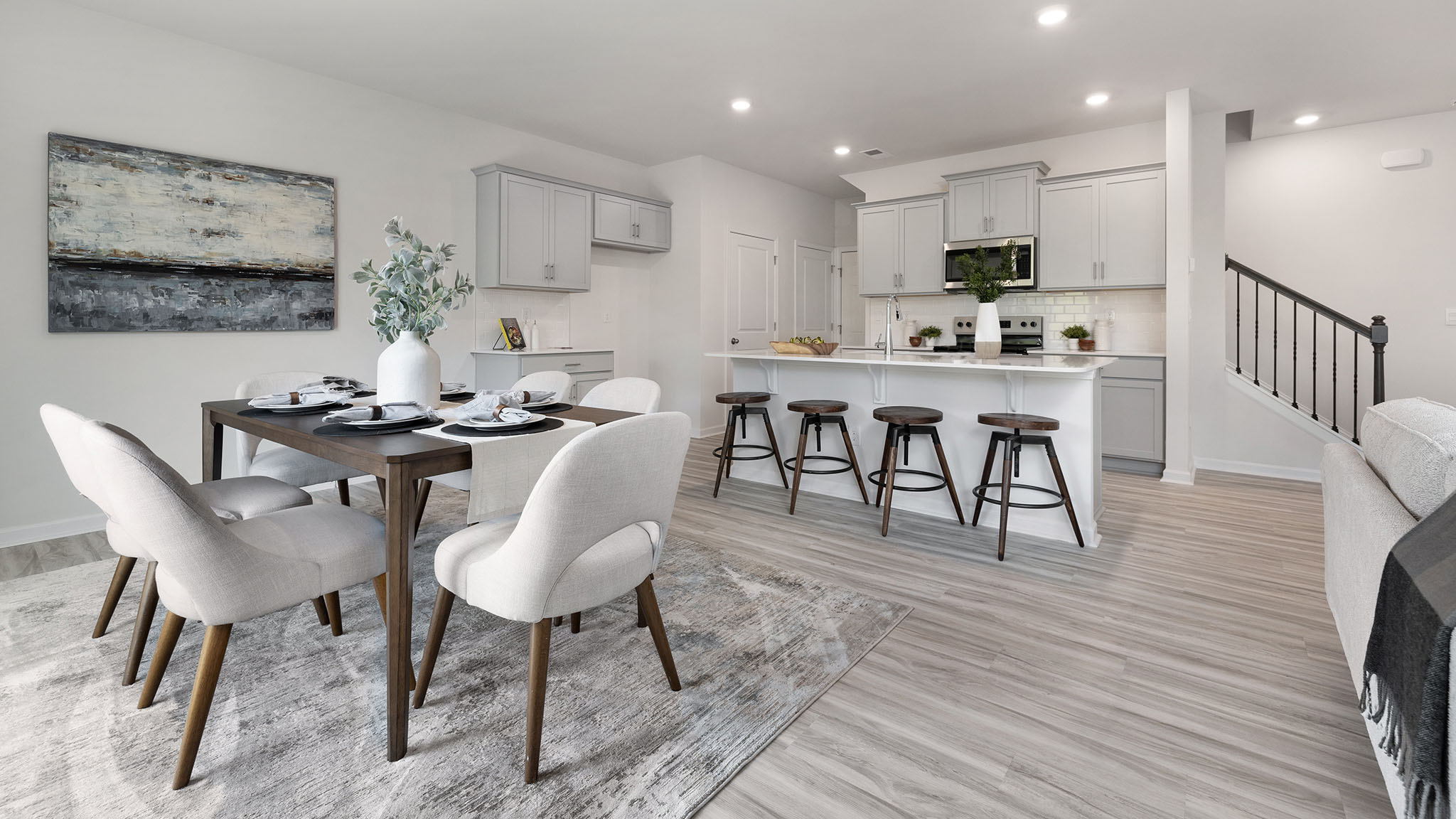 Open dining area near kitchen, with sliding glass doors