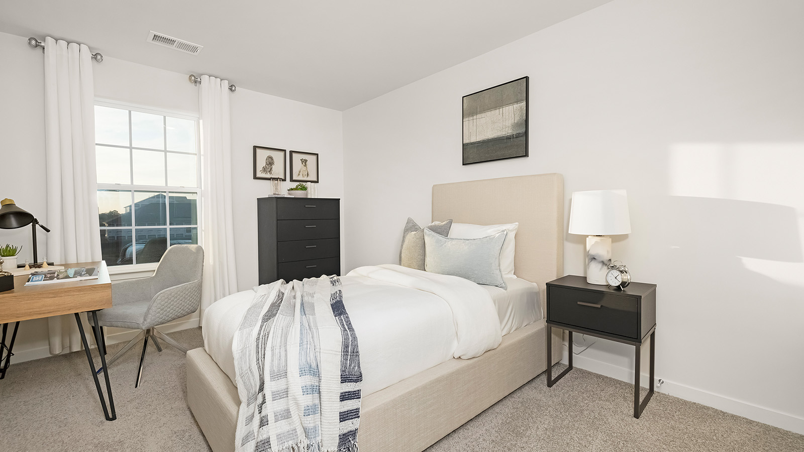 Carpeted bedroom with small window