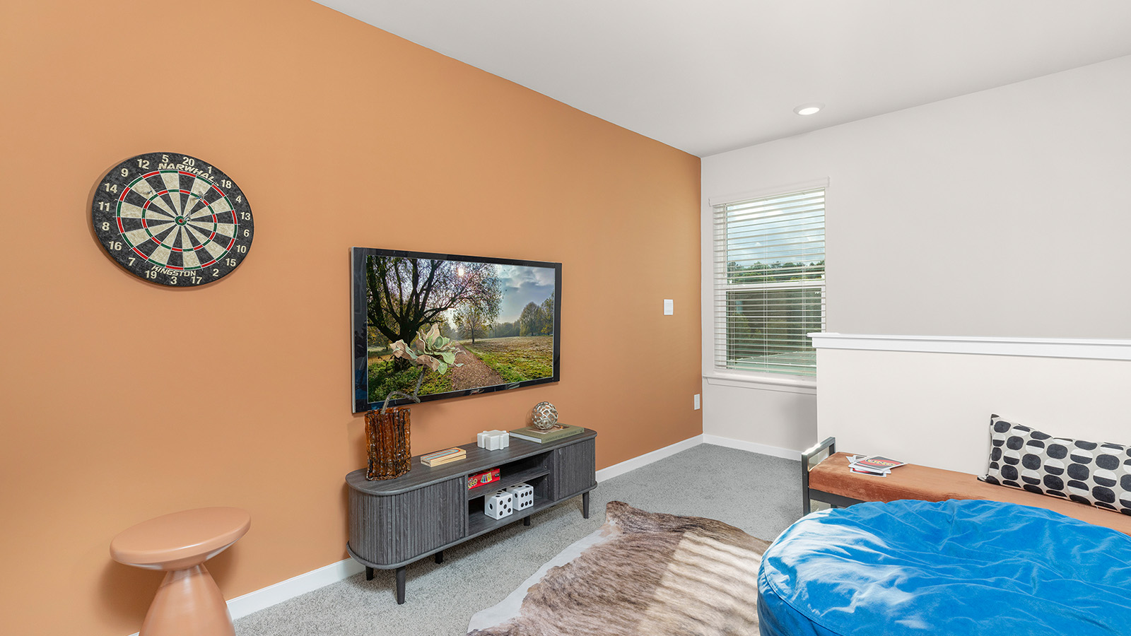 Carpeted bedroom with large window