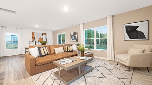 Open family room with large window off of kitchen