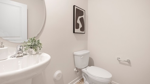 Powder bathroom with toilet and sink