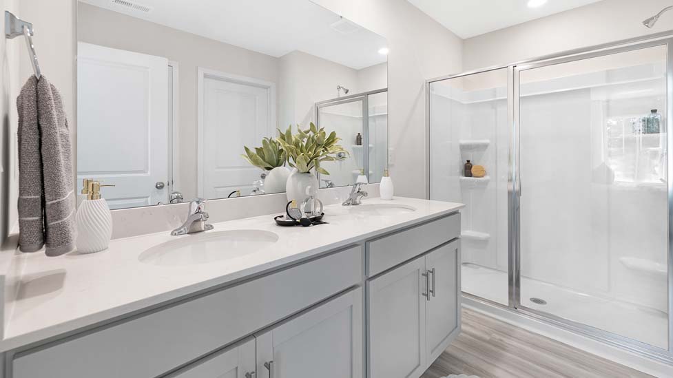 Bathroom with single sink and standing glass shower