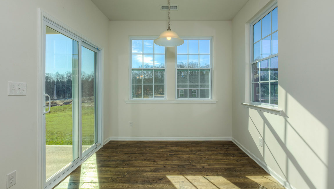 Breakfast area off kitchen with sliding glass back door