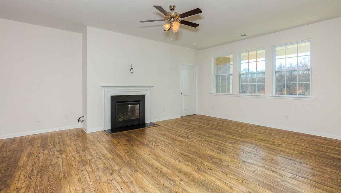 Family room with windows and fireplace