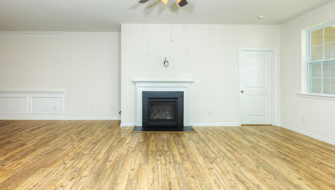 Family room with windows and fireplace