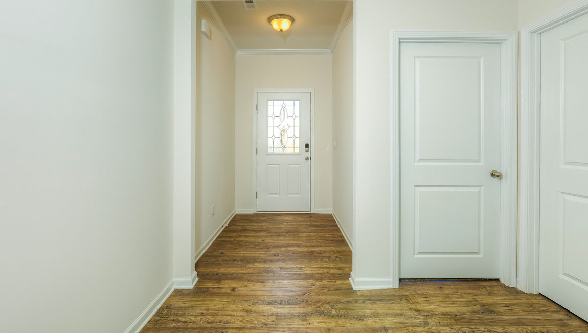 Welcoming foyer with view of hallway
