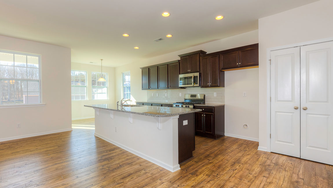 Large Kitchen and Island with stainless steel appliances