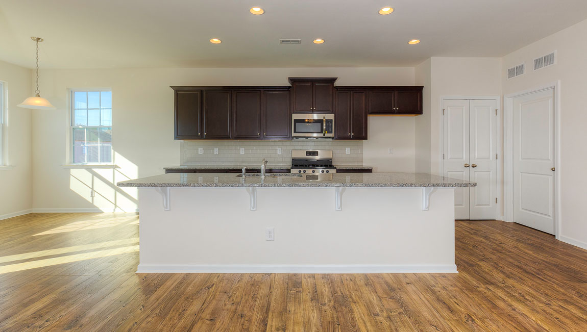 Large Kitchen and Island with stainless steel appliances