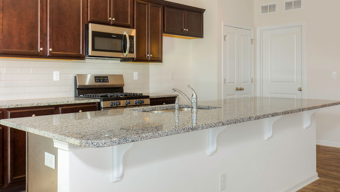 Large Kitchen and Island with stainless steel appliances