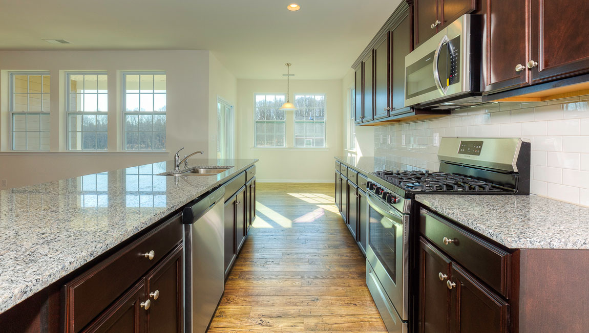 Large Kitchen and Island with stainless steel appliances