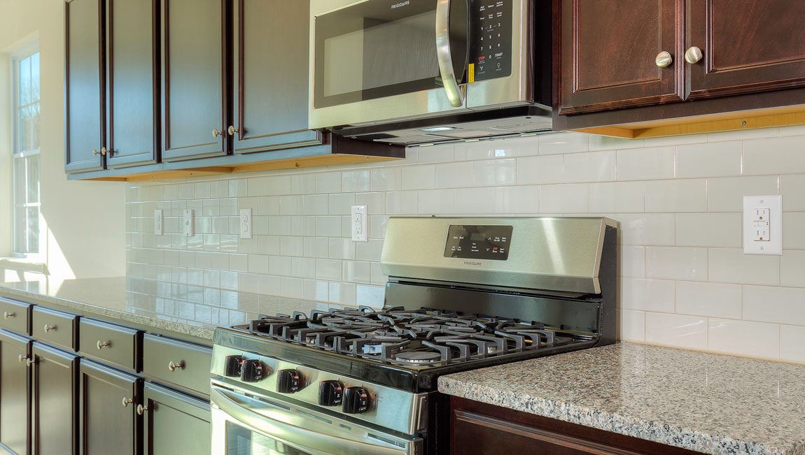Large Kitchen and Island with stainless steel appliances