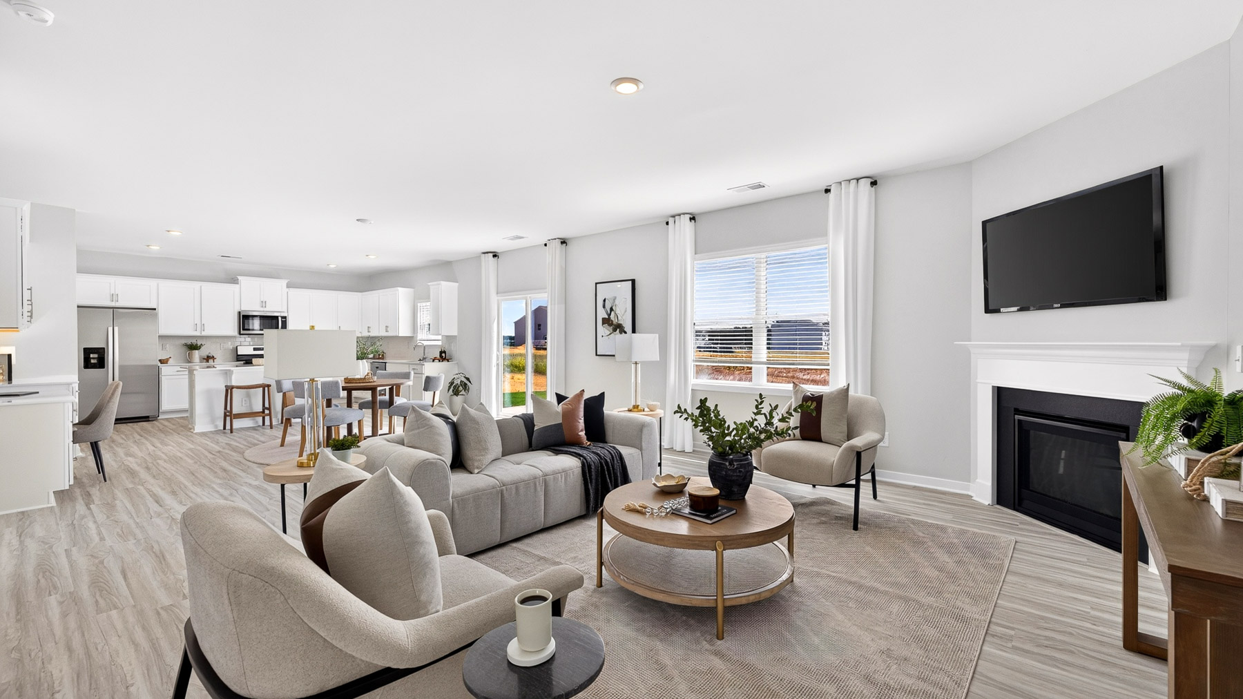 Living room area with fireplace and windows