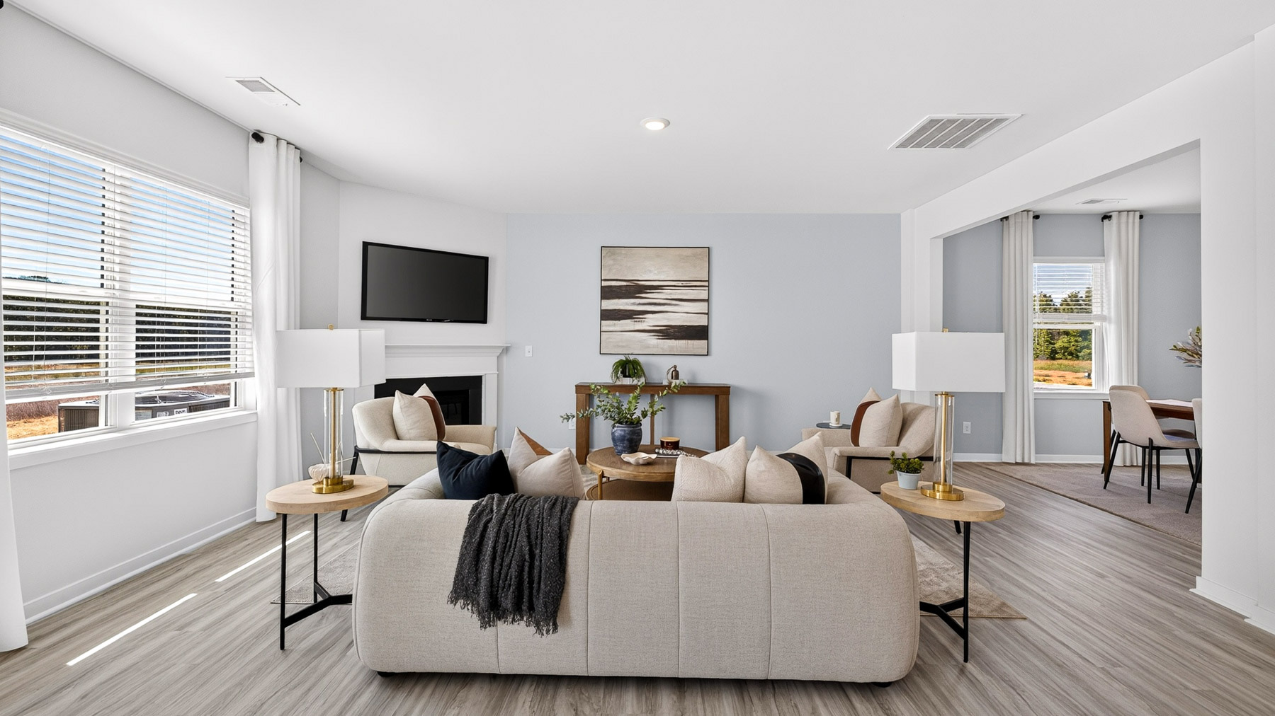 Living room area with fireplace and windows