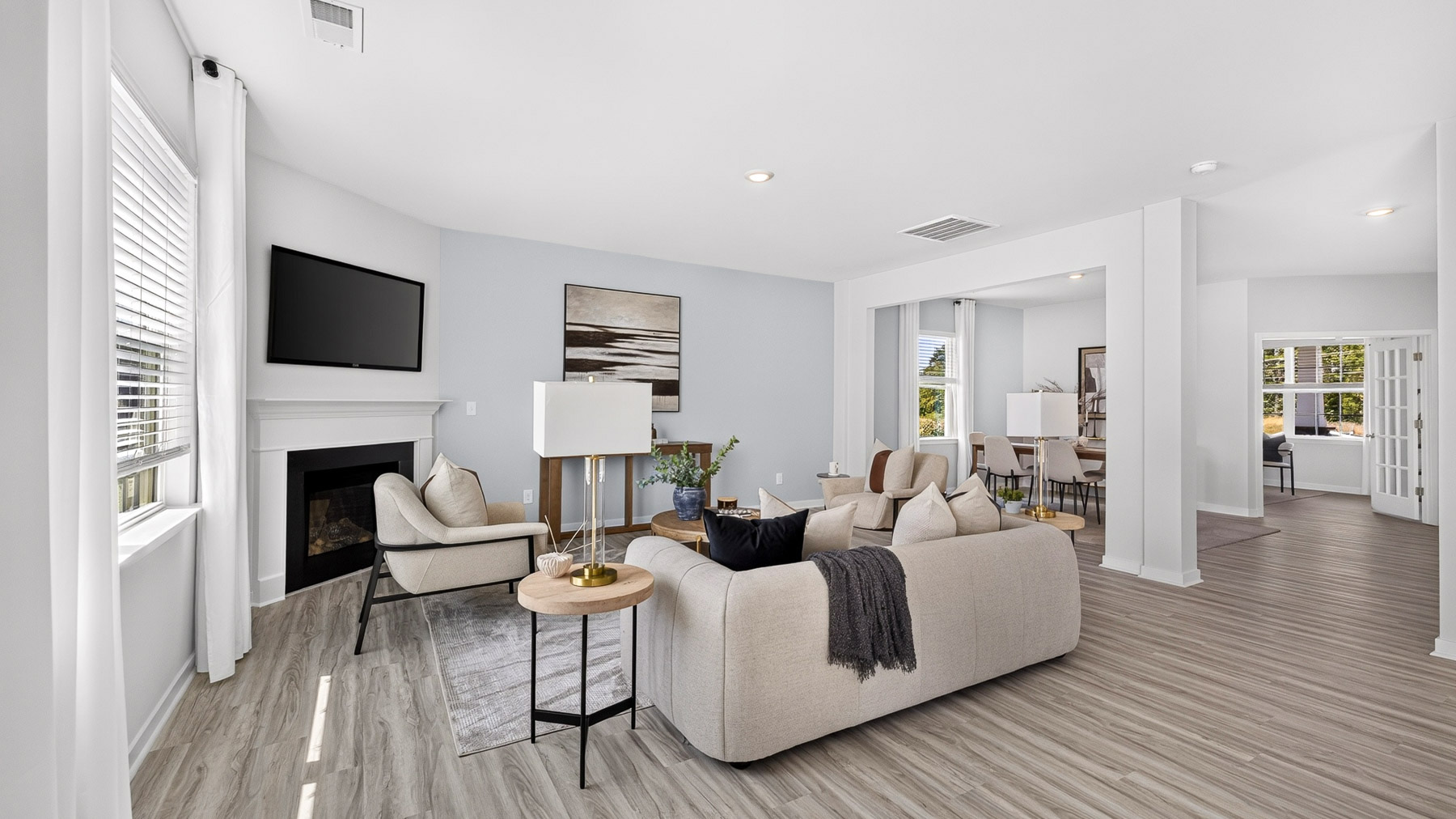 Living room area with fireplace and windows