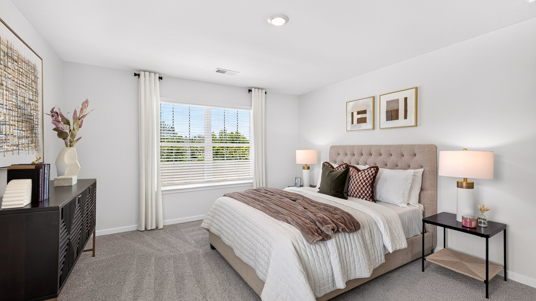 Carpeted bedroom with windows