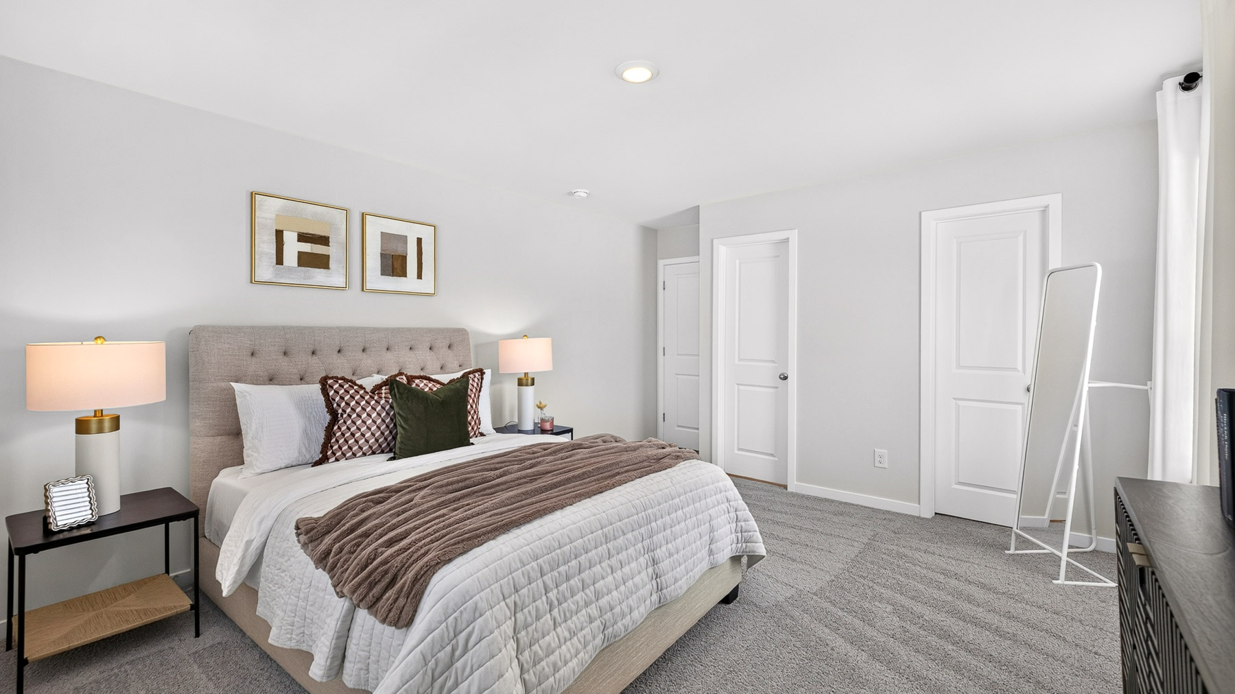 Carpeted bedroom with windows