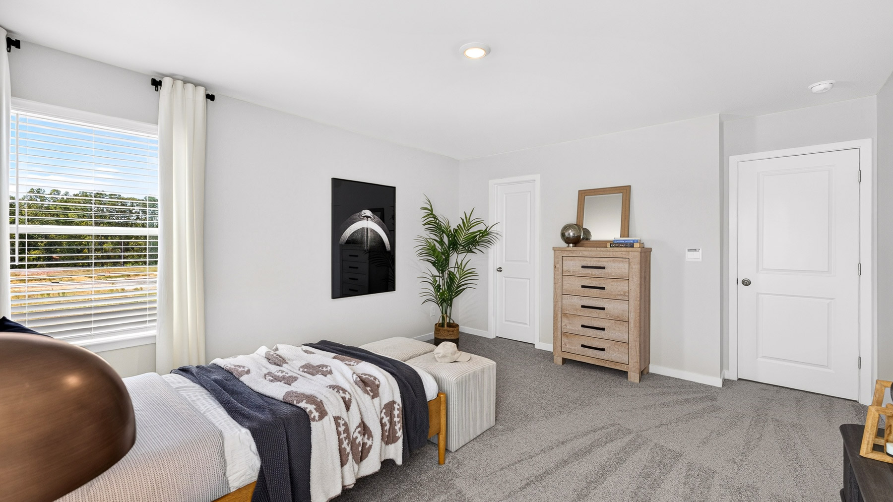 Carpeted bedroom with windows