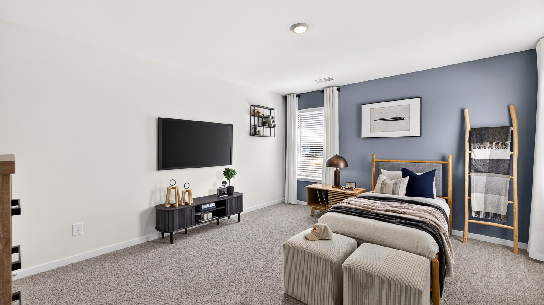 Carpeted bedroom with windows
