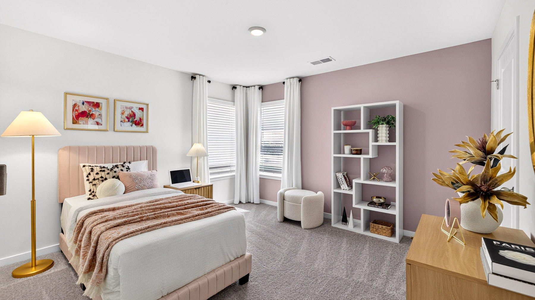 Carpeted bedroom with windows