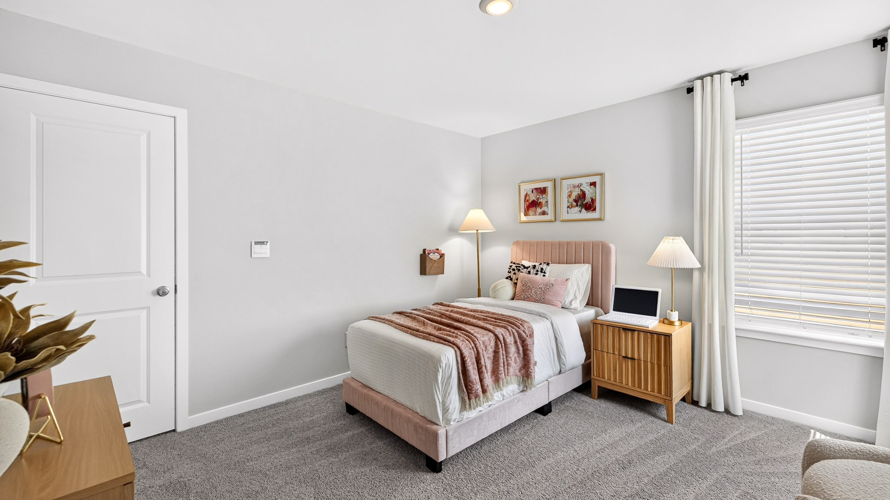 Carpeted bedroom with windows