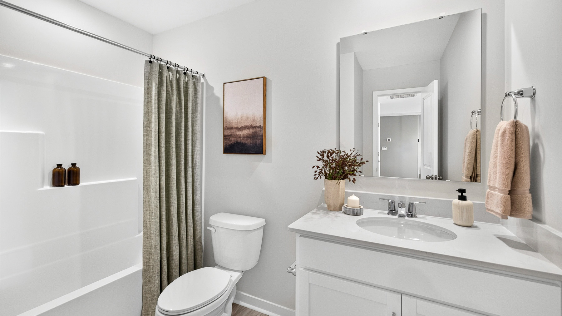 Bathroom with double sinks and standing tub shower