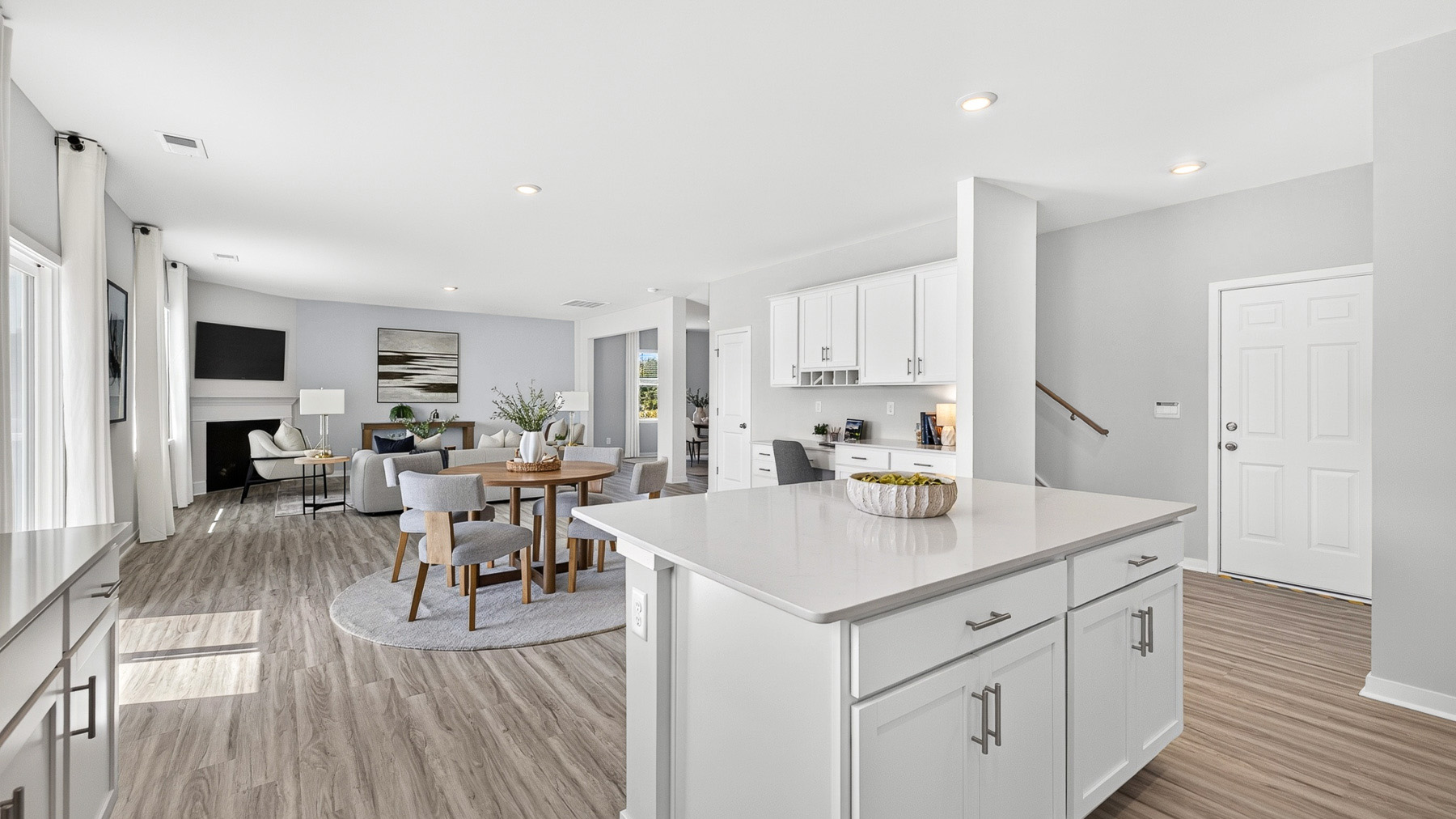 Kitchen and island with stainless steel appliances