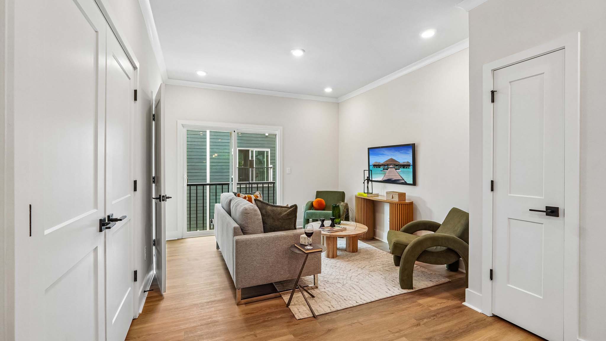 Living room with windows and wood floors