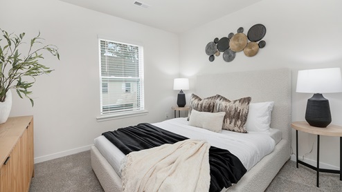 Carpeted bedroom with window