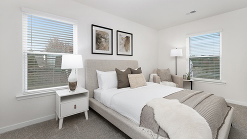Carpeted bedroom with window
