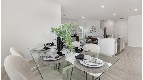 Dining area off of kitchen with large window
