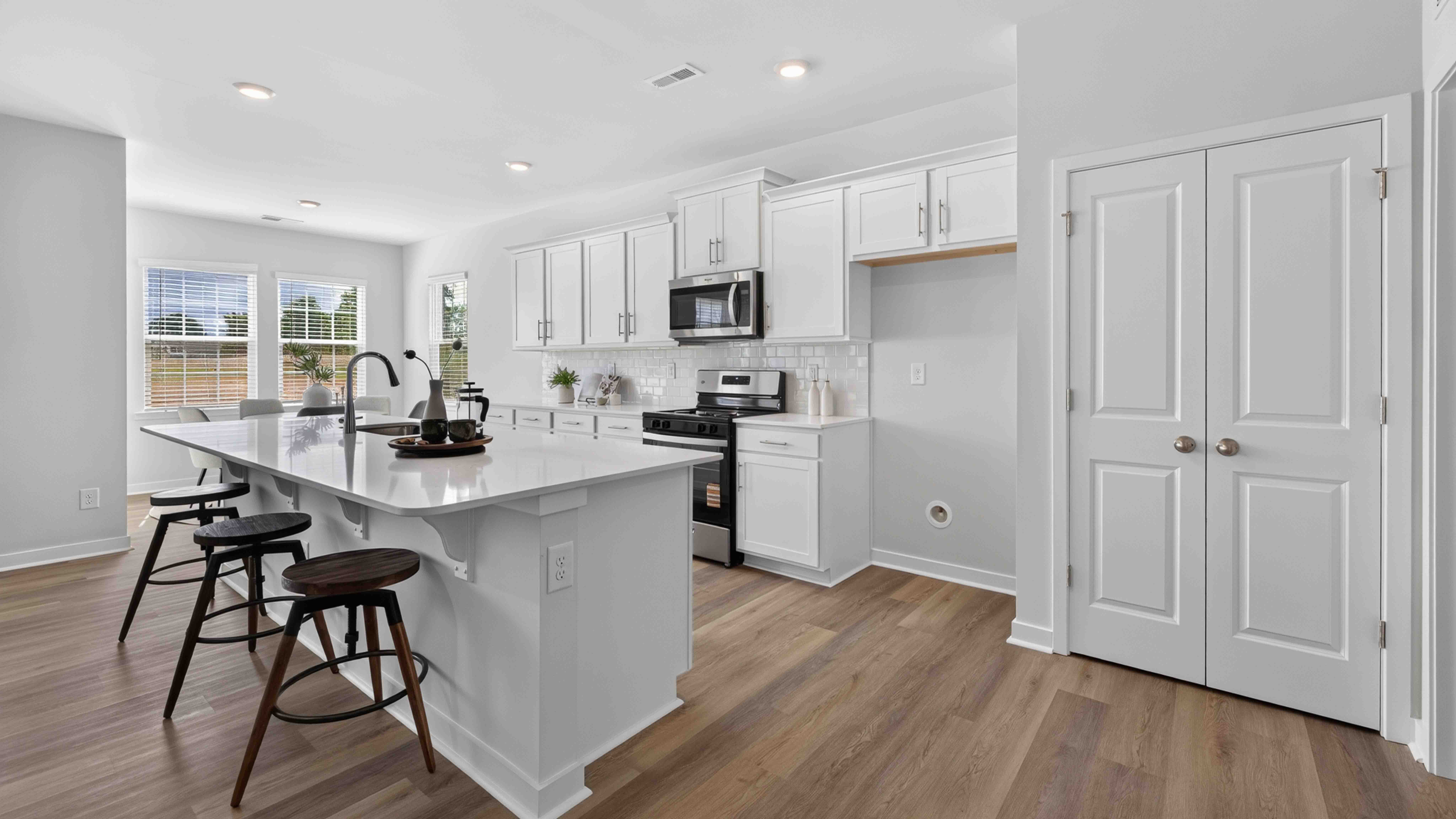 Large Kitchen and Island with stainless steel appliances