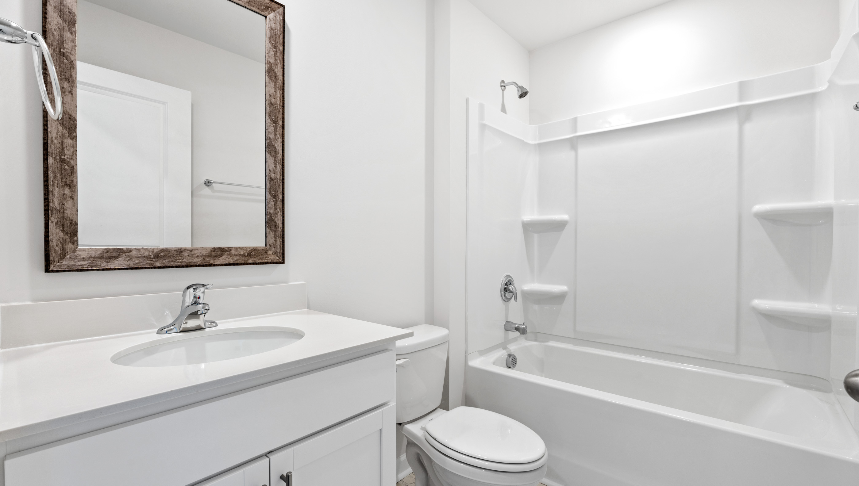 Bathroom with vanity and tub.