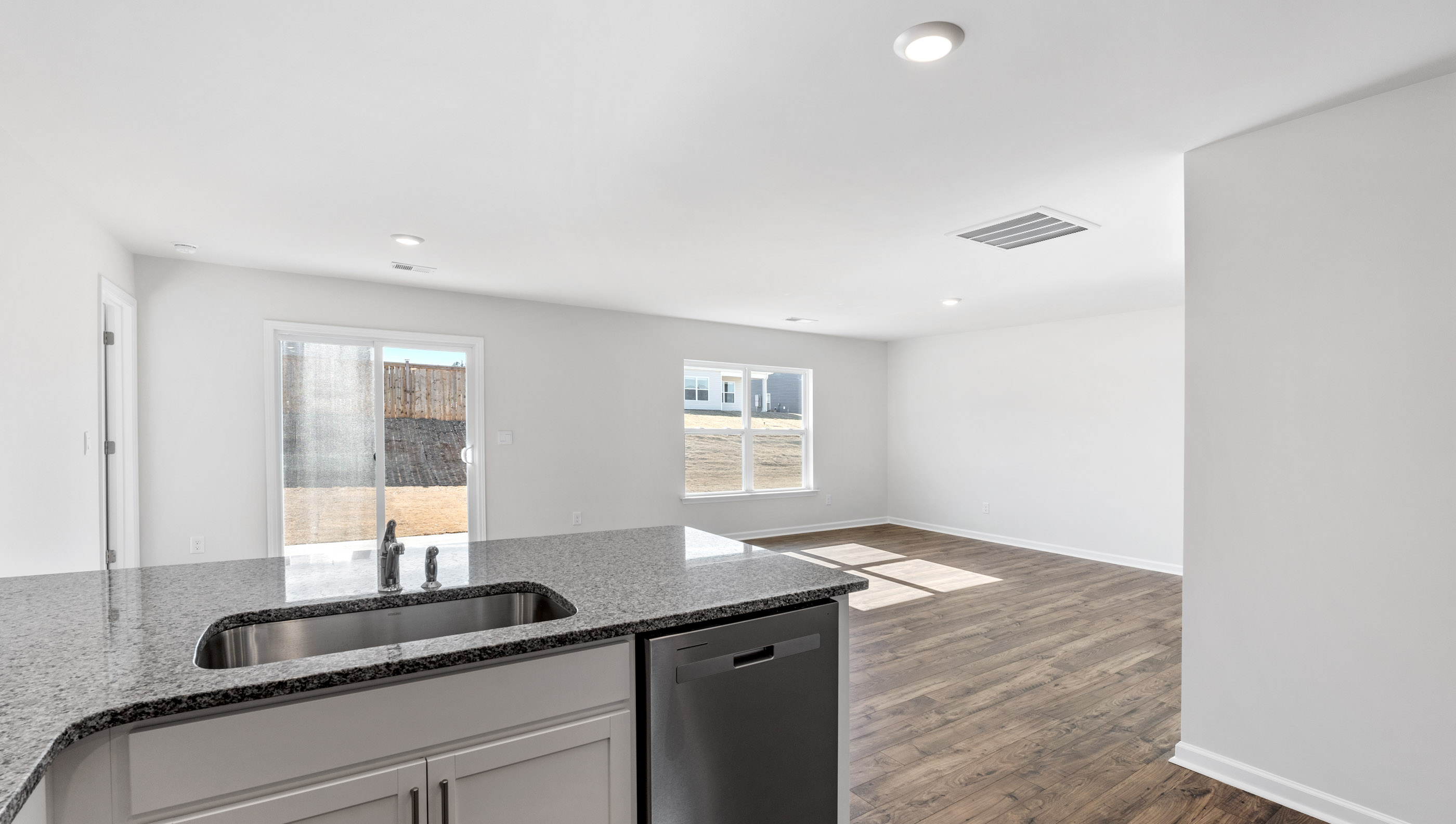 Kitchen with granite countertops and stainless steel appliances.