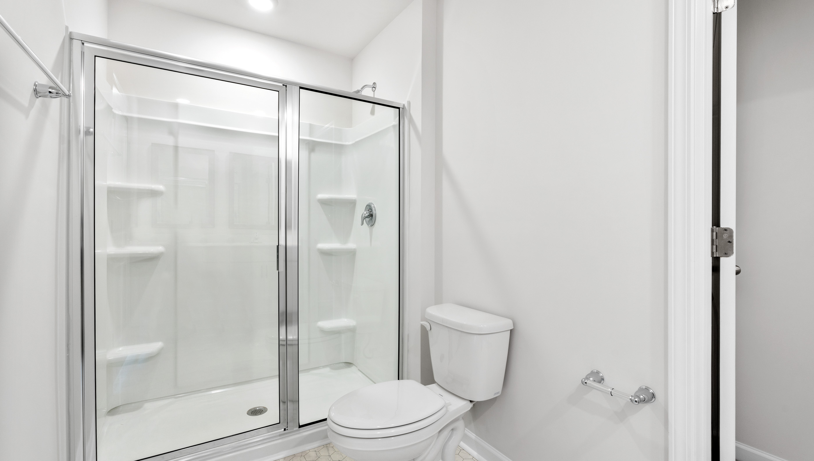 Bathroom with walk in shower.