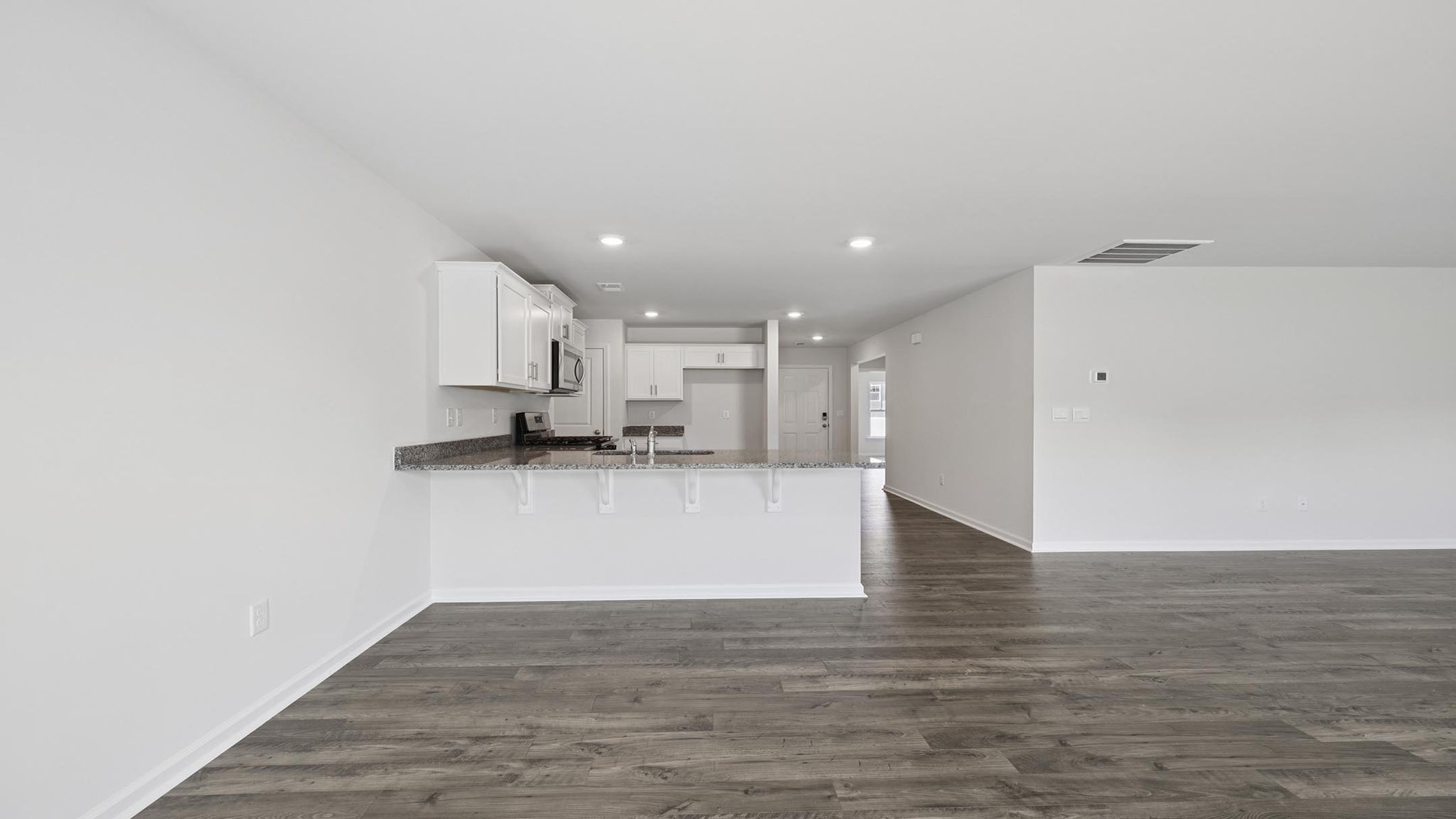 Great room looking at kitchen.