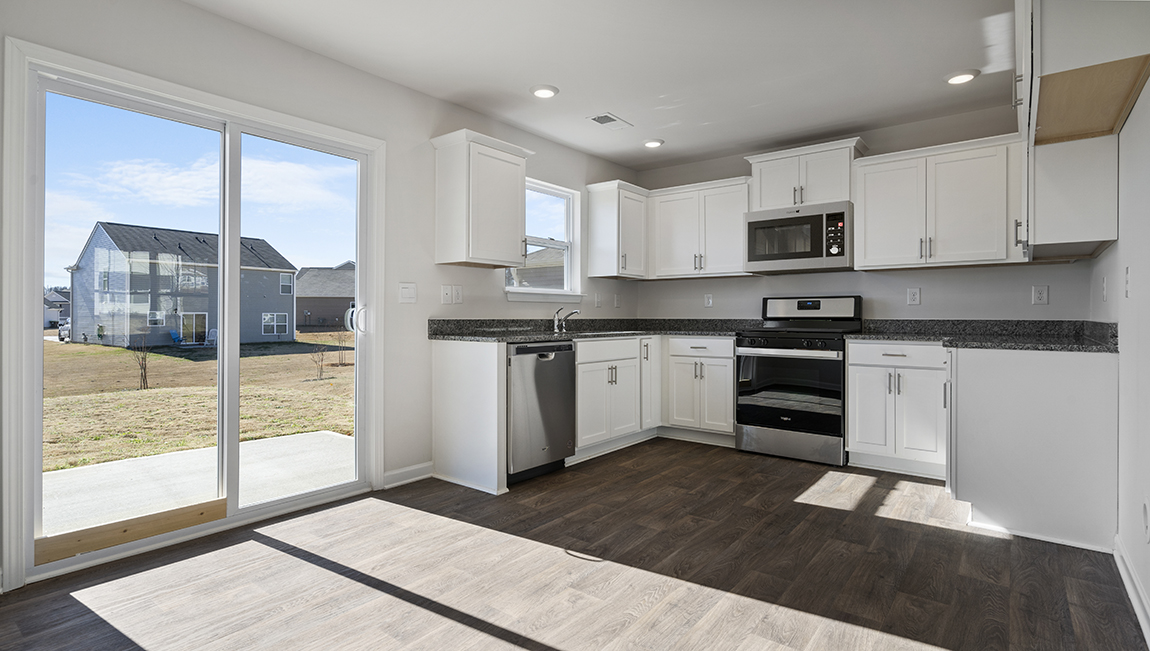 Kitchen with granite counter tops.