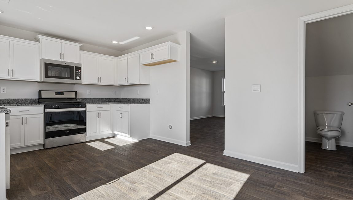 Kitchen with granite counter tops.