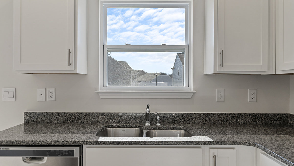 Kitchen with granite counter tops.