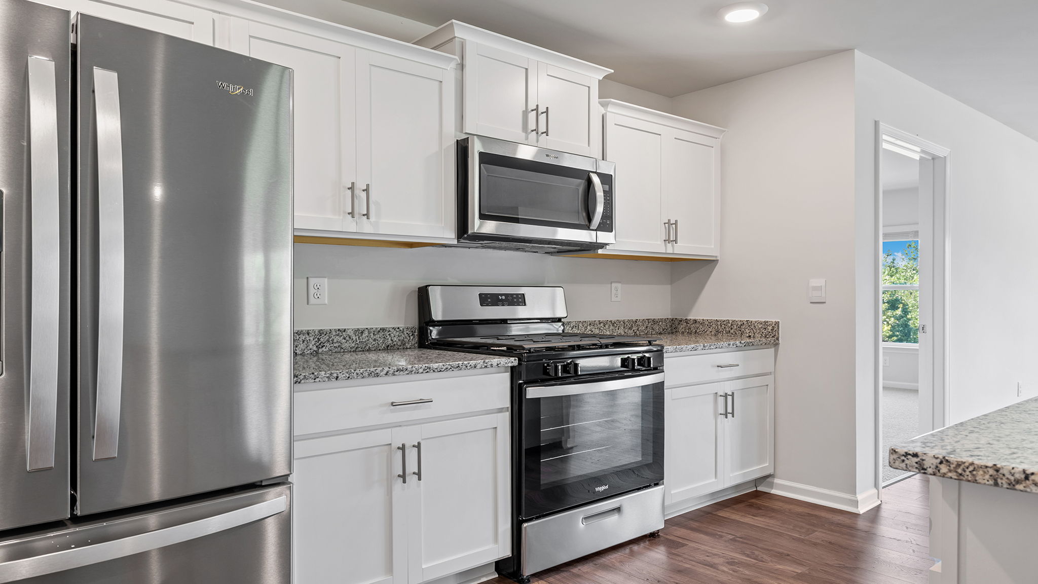Kitchen with granite countertop.