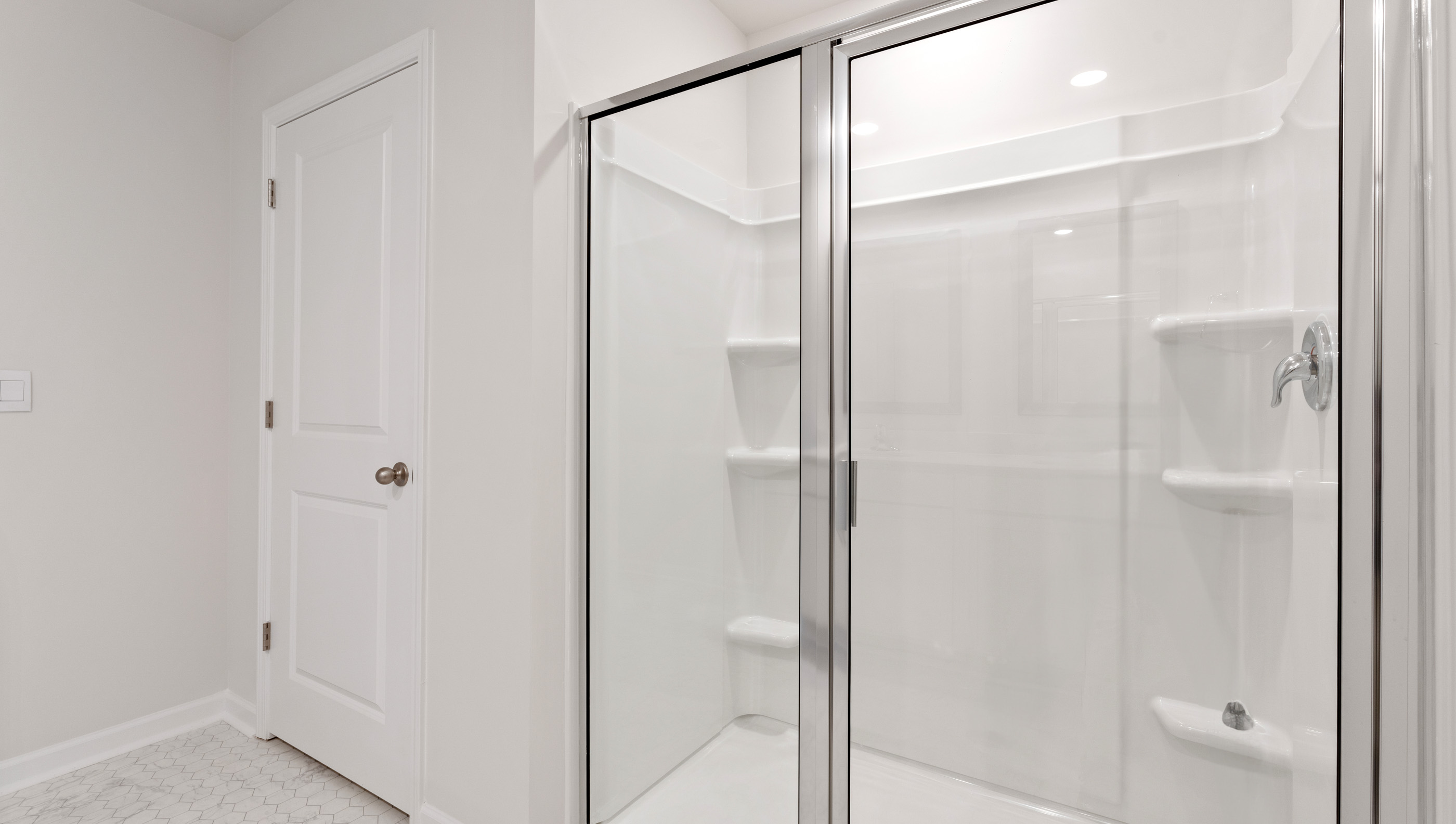 Bathroom with walk in shower.