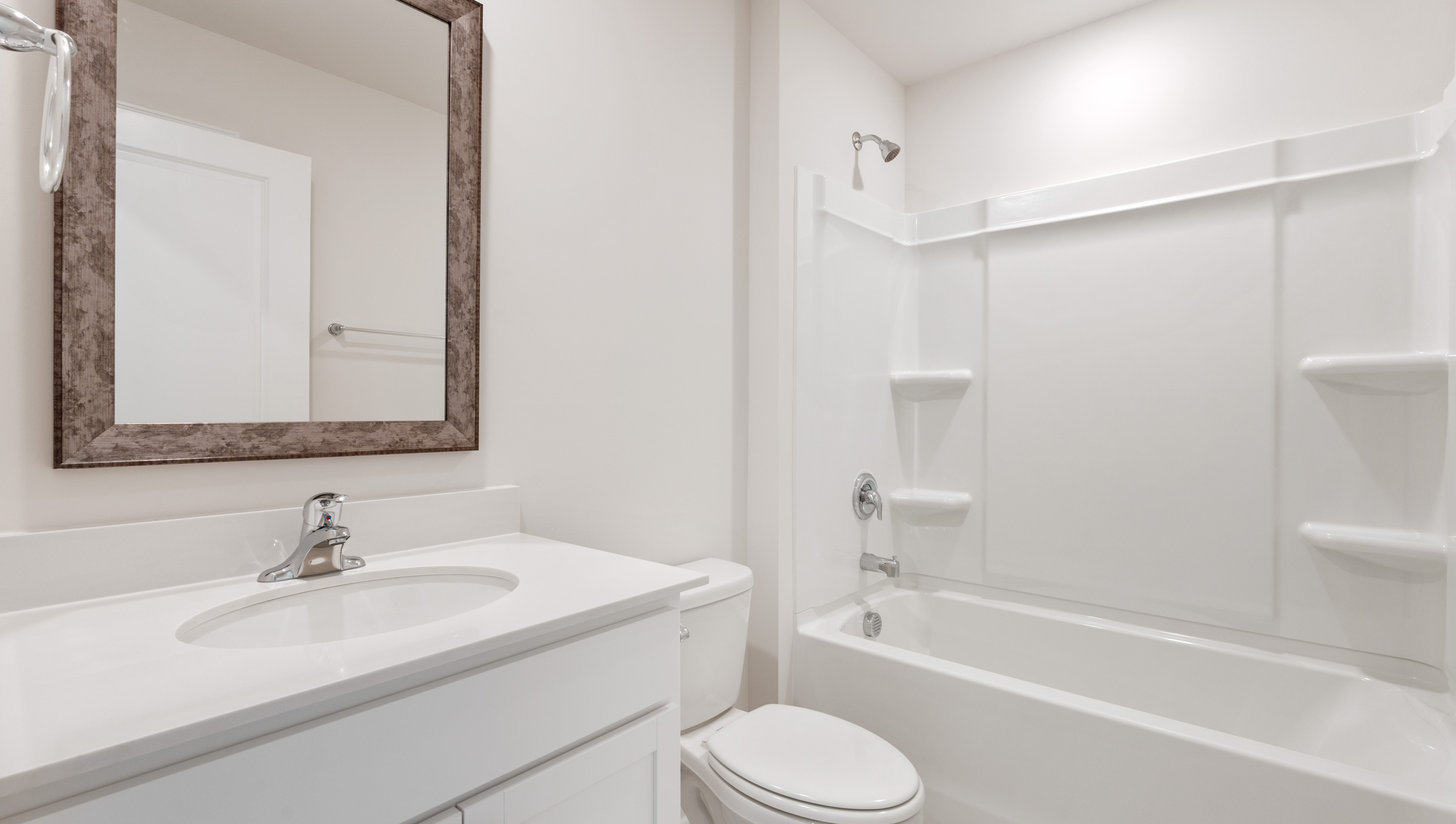 Bathroom with vanity and tub.