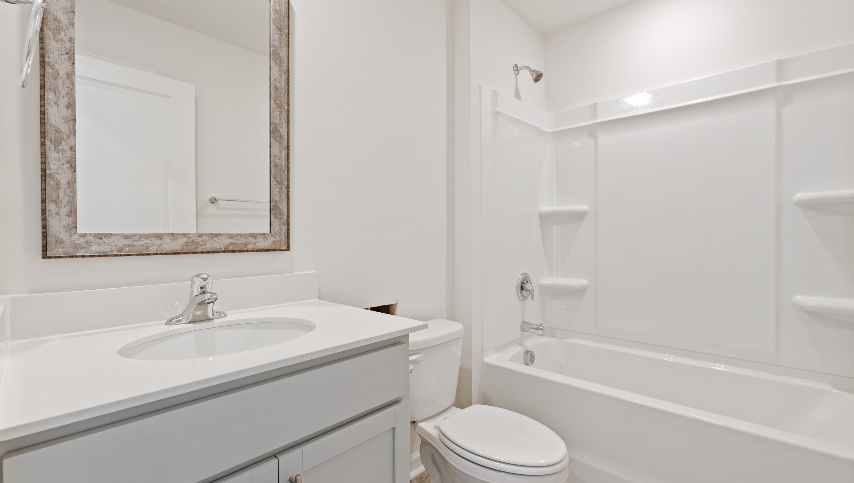 Bathroom with vanity and tub.