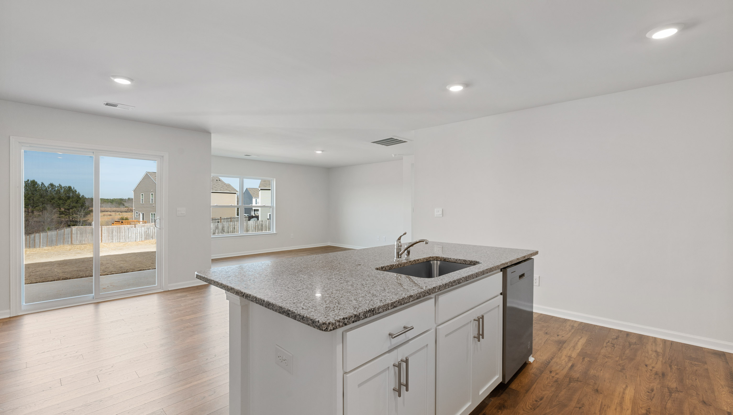 Kitchen and island with granite countertops.