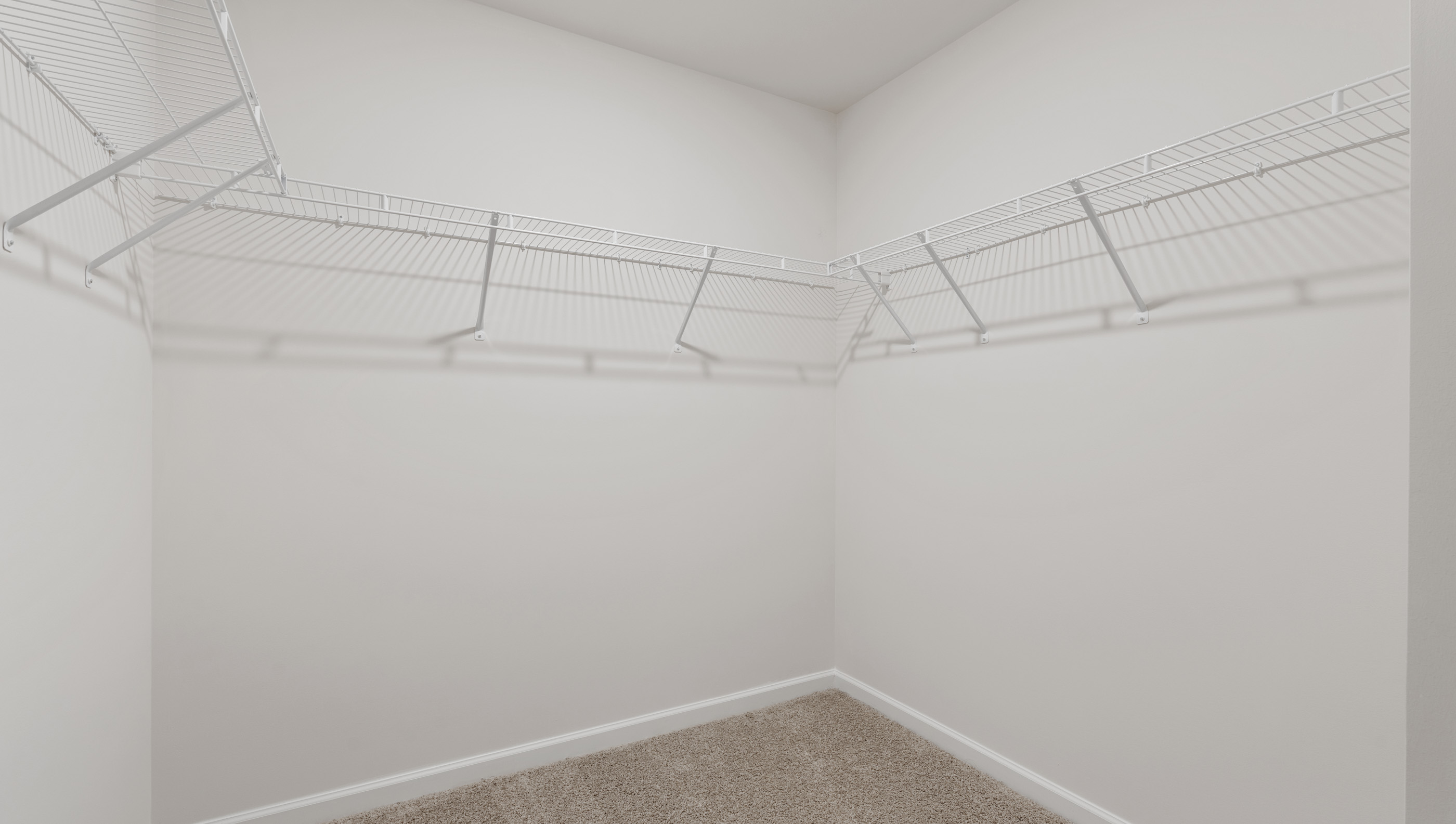 Walk in shower with shelves.