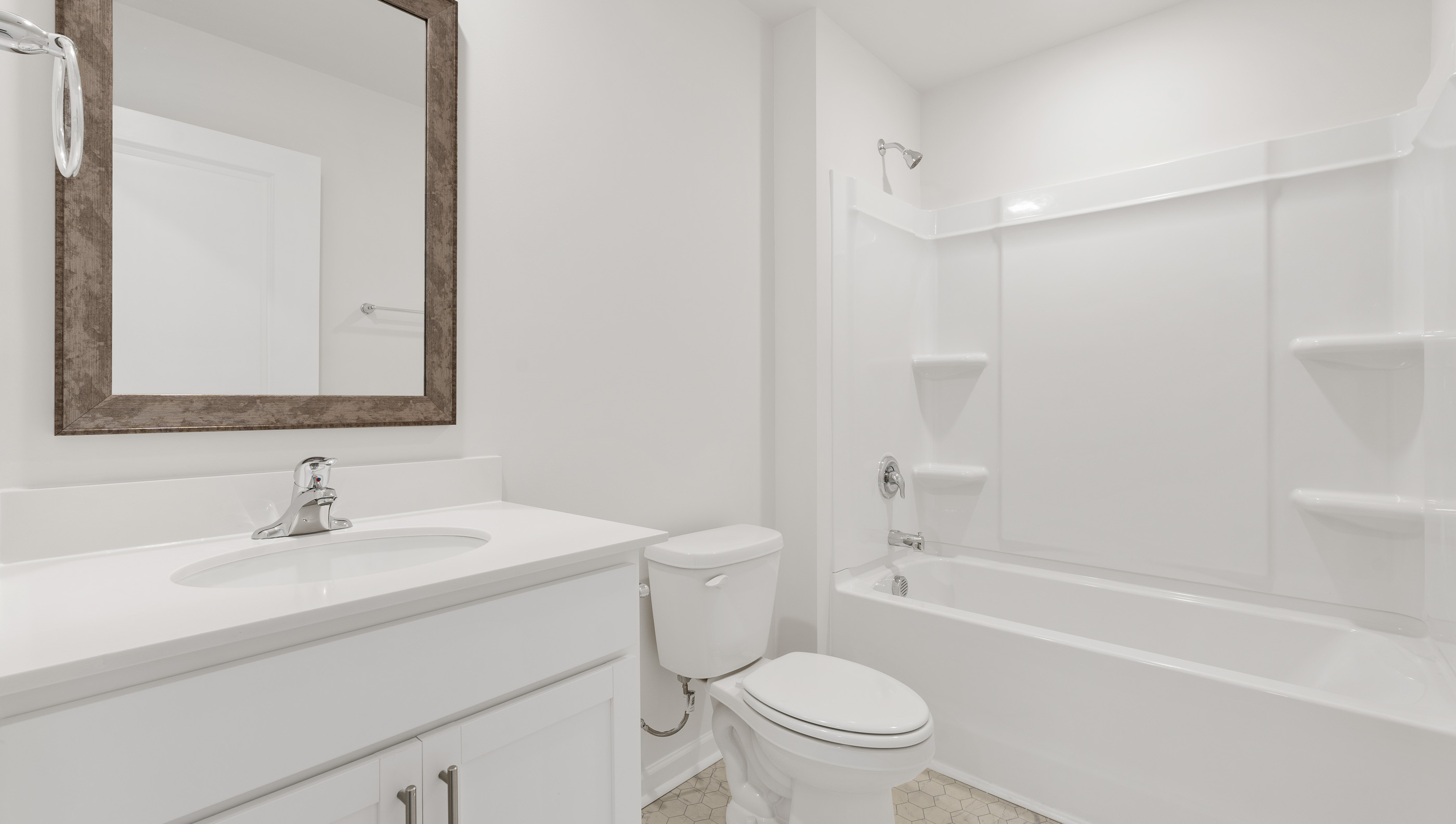 Bathroom with vanity and tub.