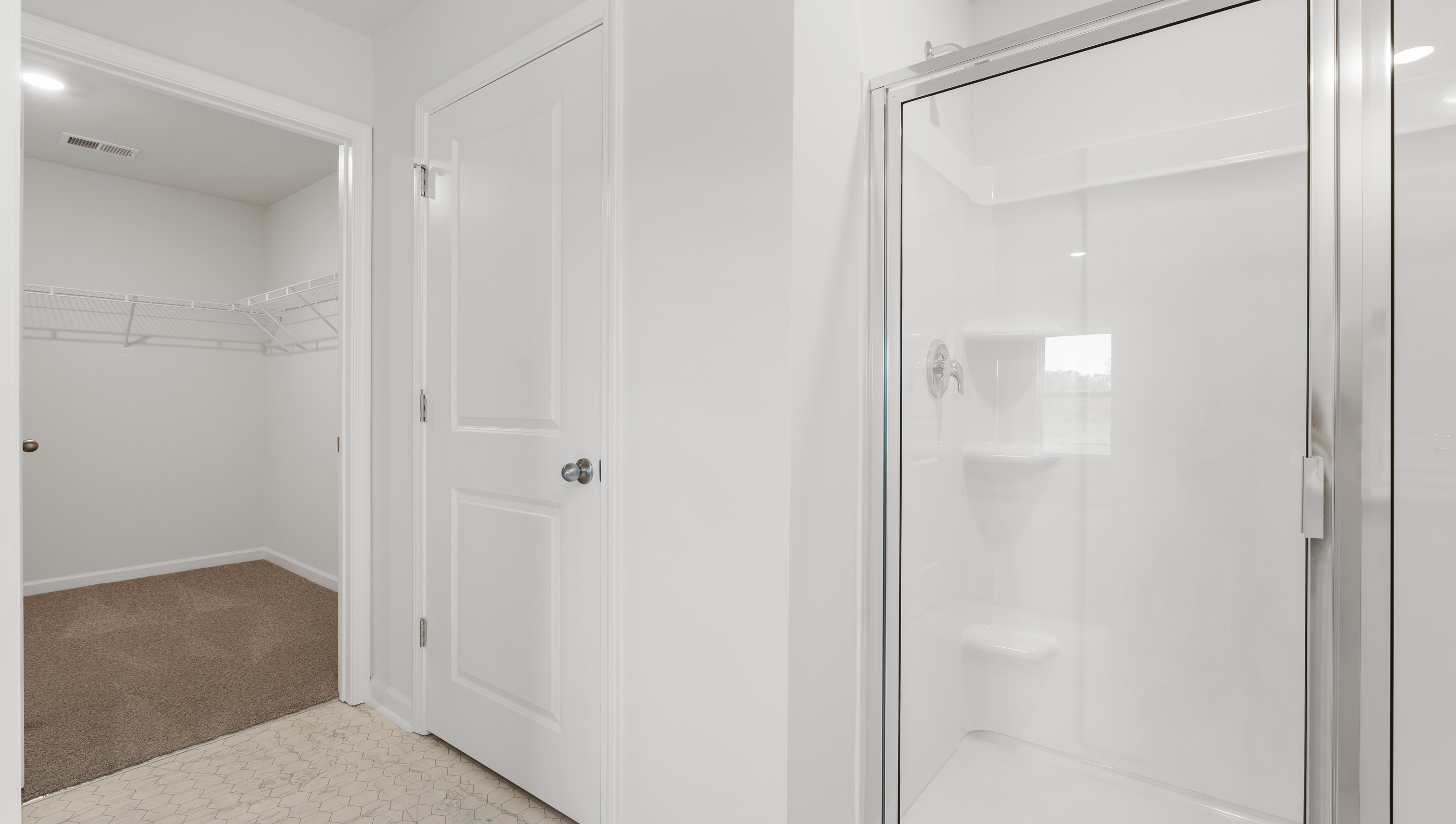 Bathroom with walk in shower.