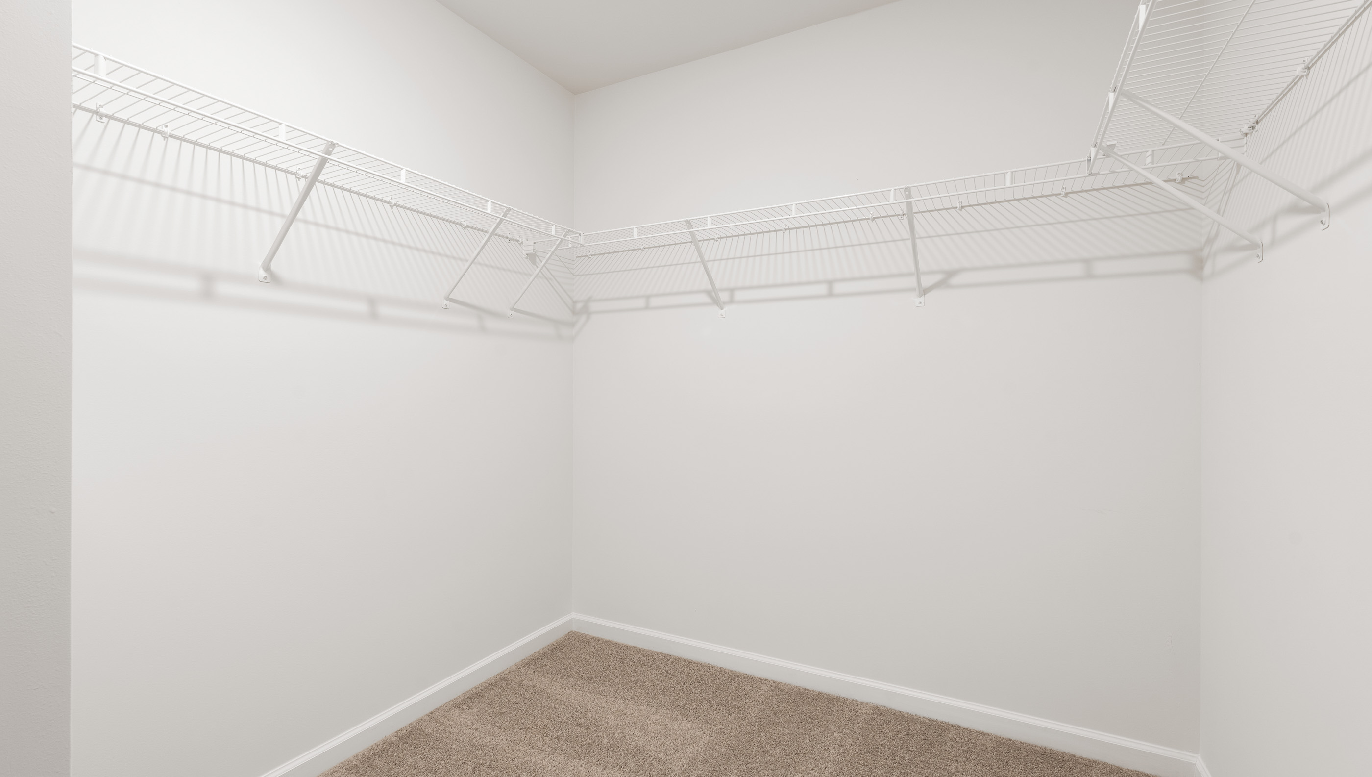 Walk in shower with shelves.