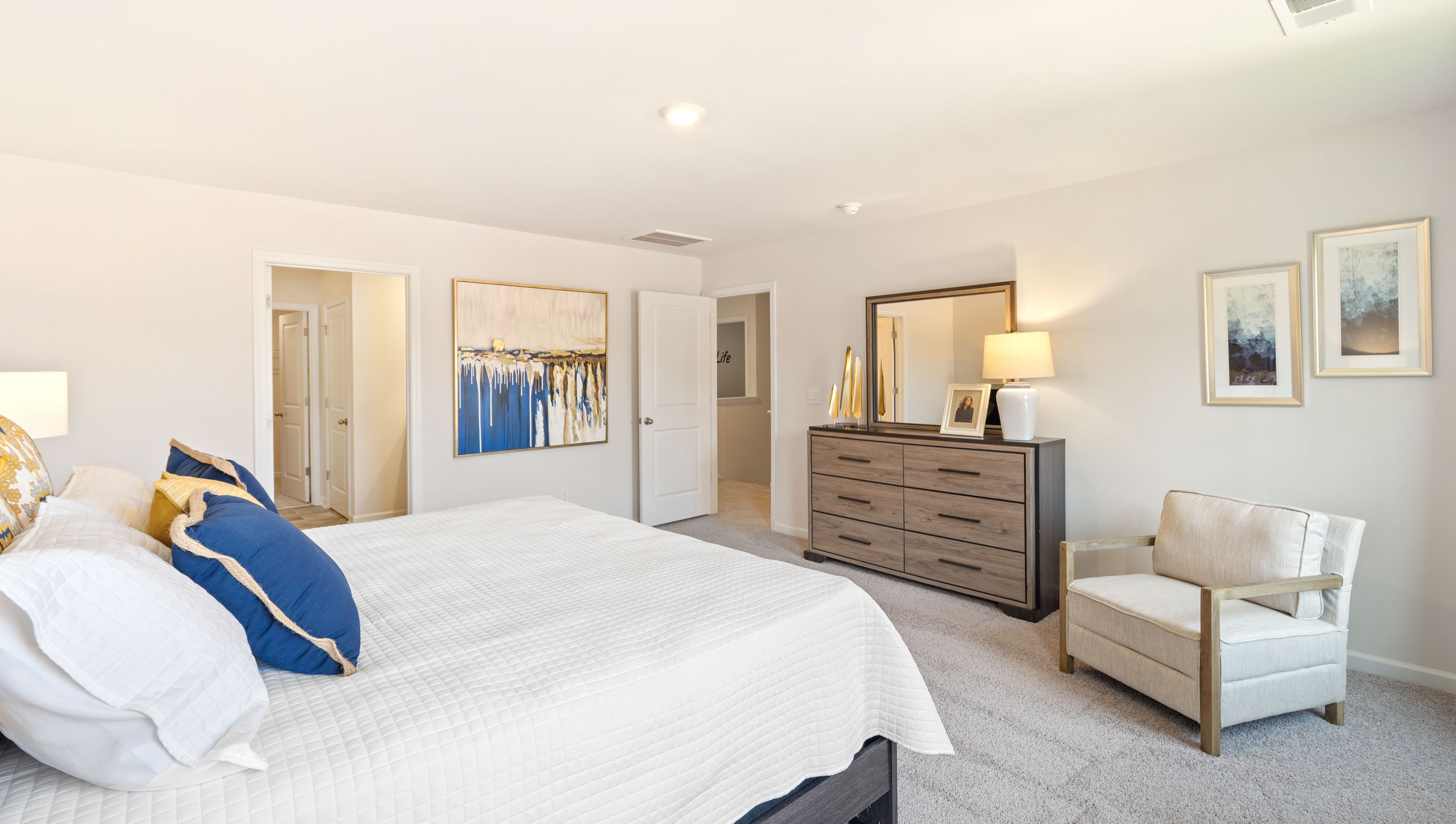 Bedroom with carpet and windows.